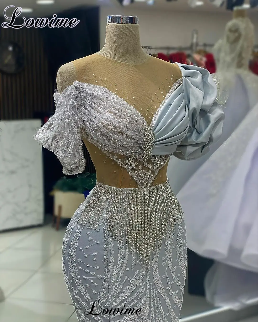 Silver prom dresses with beaded off-shoulder design and side slit