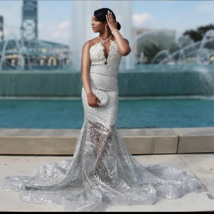 Silver prom dresses with glitter, sequins, rhinestones, and ruffle details